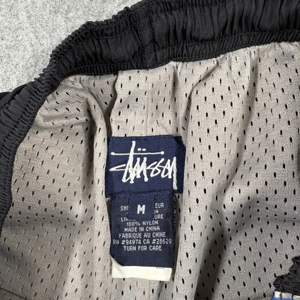 90s Stussy Mens Black Nylon Track Pants Blue Side Stripe Mesh Lined Size Medium